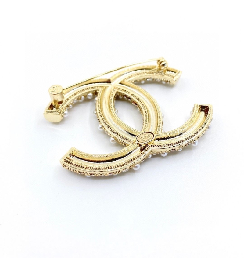 Ch**el brooches